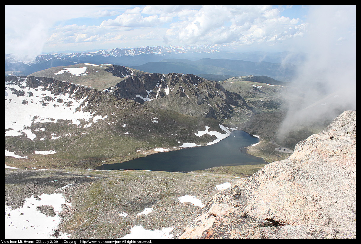 Mountain tops with snow seen from the top of the highest mountain.