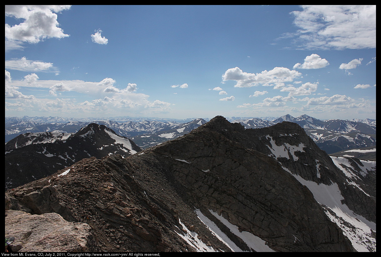 Mountain tops with snow seen from the top of the highest mountain.